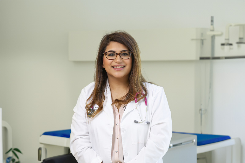 Dr. Mehak Gulati Primary Care Physian in Rocklin, CA smiling in her health clinic